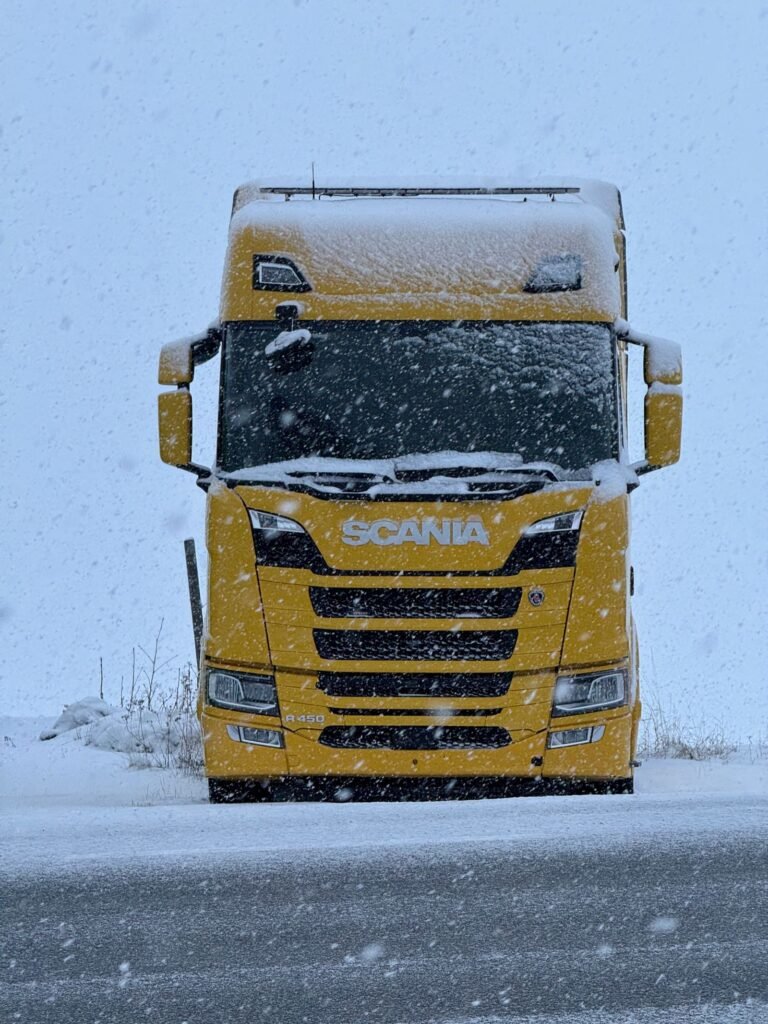 Front of a Scania HGV tractor unit on a winter road