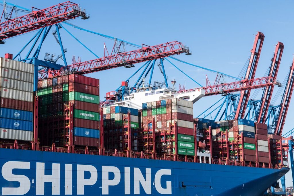 Container ship being loaded by cranes at Hamburg port